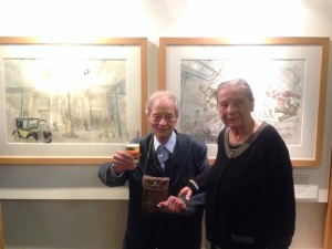 Guy Dessicy and his wife in front of the 2 Bob De Moor drawings.